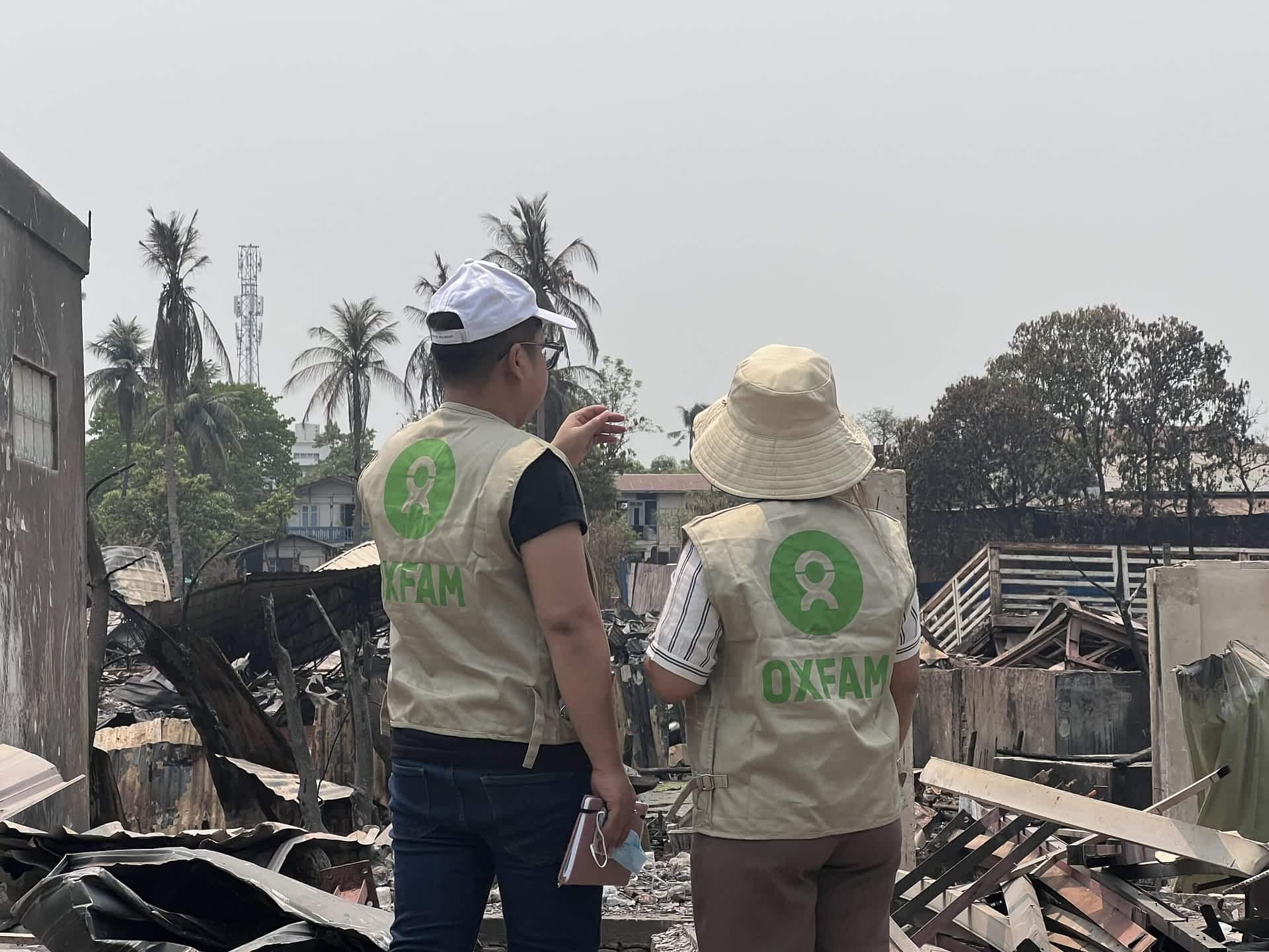 Oxfam staff discussion about the devastation at the areas they are visiting in Mandalay